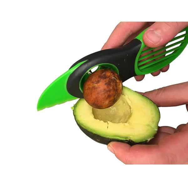 Avocado splitter pitter slicer tool removing a pit