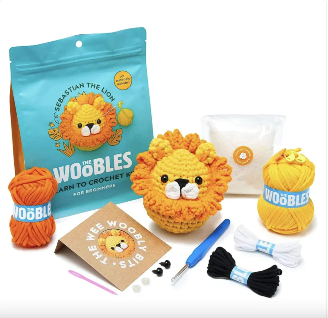 Beginner crochet kit with yarn, tools, and lion design